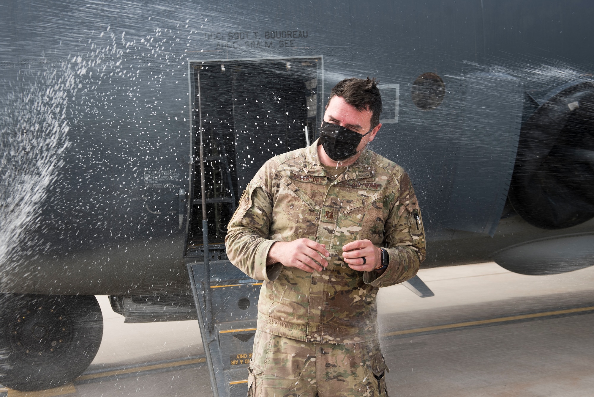 Capt. Tyler Davenport, 551st Special Operations chief of safety, gets sprayed after a fini flight at Cannon Air Force Base, N.M., April 29, 2021. The flight was flown to commemorate the phasing out of the 551 SOS. (U.S. Air Force photo by Senior Airman Vernon R. Walter III)