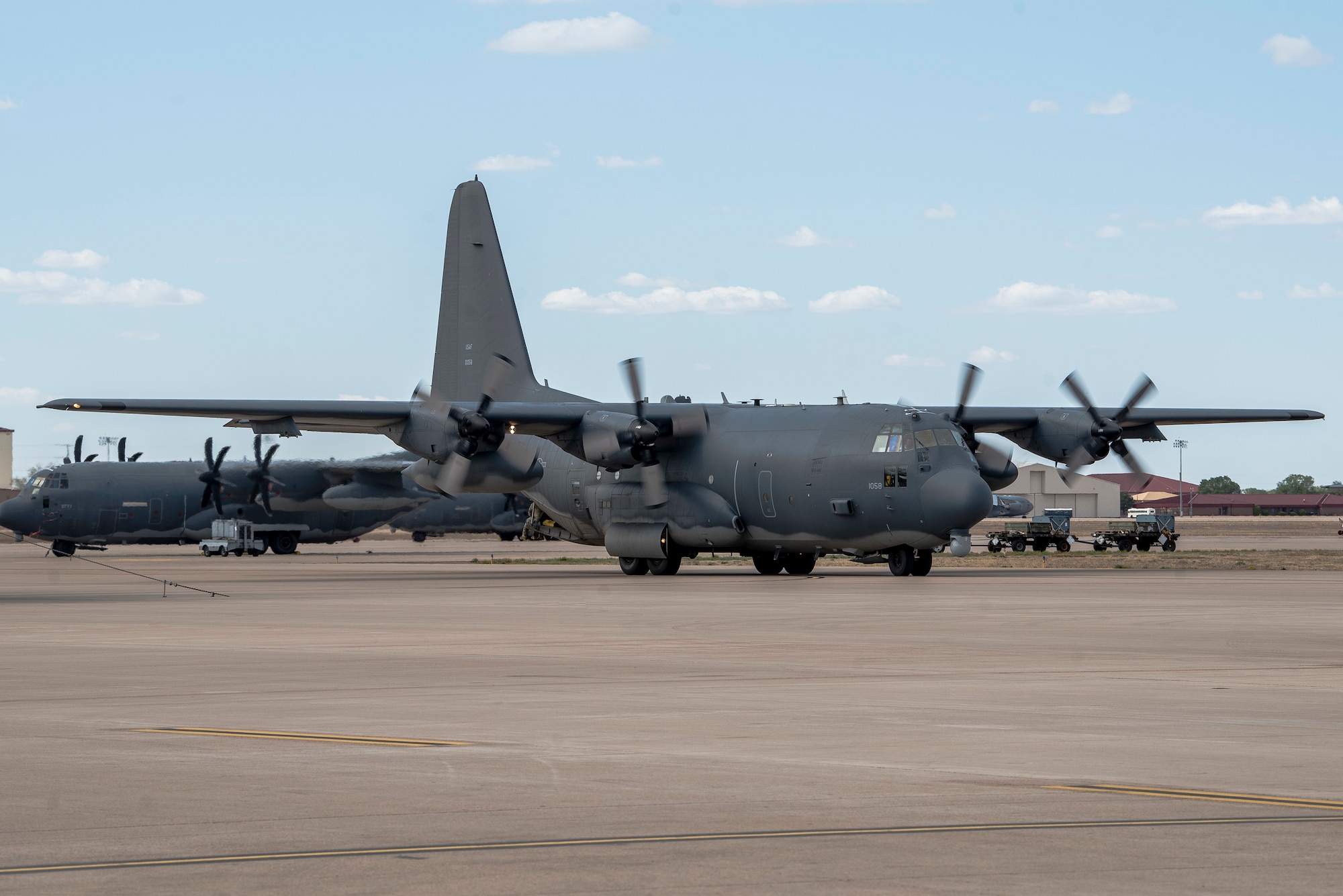 An AC-130W aircraft, piloted by members of the 551st Special Operations Squadron, pulls in after their fini flight at Cannon Air Force Base, N.M., April 29, 2021. The squadron will be officially made inactive June 15, 2021, but the flight marked the end of training at the 551 SOS. (U.S. Air Force photo by Senior Airman Vernon R. Walter III)