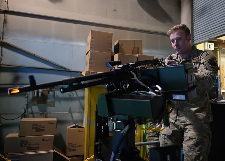 Staff Sgt. Phillip Hill, 37th Helicopter Squadron flight chief and evaluator special mission aviator, demonstrates the use of an aerial gunnery simulator, made to simulate the M240D rifle on the UH-1N Huey, April 28, 2021 at F.E. Warren Air Force Base, Wyo. The simulation is likely to save the squadron millions of dollars in ammunition, fuel costs and range fees.