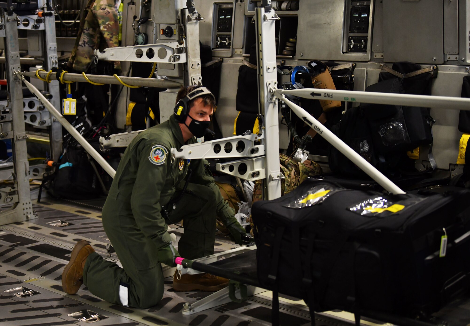 Image of an Airman kneeling.