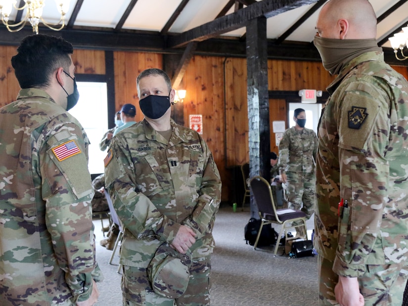 U.S. Army Capt. Aaron Gaber (middle) speaks with two soldiers, Spc. Byan Velez from Bethlehem, Pa., (left) and Spc. Seven Barnishin from Pittsburgh, Pa., (right) returning from deployment to the Middle East prior to the start of their welcome home ceremony May 2, at Fort Indiantown Gap, Pa. Approximately 30 Soldiers with the 213th Personnel Company, 213th Regional Support Group, Pennsylvania Army National Guard, were deployed to the Middle East in support of Operations Freedom’s Sentinel, Spartan Shield and Inherent Resolve. (US Army National Guard Photo by Spc. Vail Forbeck)