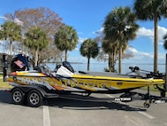 a yellow boat on a trailer.