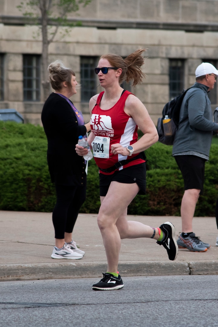 Maj. Amanda Schmid, a helicopter pilot and full-time administrative officer with the Nebraska Army National Guard's 1-376th Aviation Battalion, runs the Lincoln half-marathon in Nebraska, May 2, 2021.