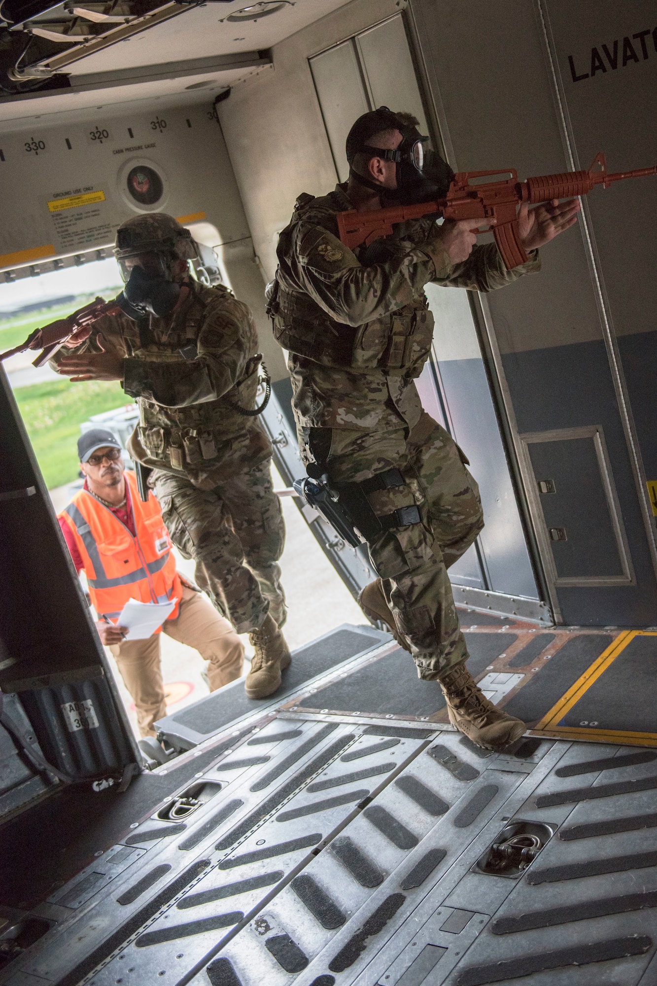 U.S. Air Force Staff Sgt. Bradley Knotts and Staff Sgt. Ryan Jenkins, with the 167th Security Forces Squadron, enter a C-17 Globemaster III aircraft during a Counter CBRN (Chemical, Biological, Radiological, and Nuclear) All-Hazard Management Response, or CAMR, exercise at the 167th Airlift Wing, Shepherd Field, Martinsburg, West Virginia, April 30, 2021. CAMR is a hybrid program of classroom lecture, discussion and tabletop exercises that culminate in a full scale emergency response exercise.