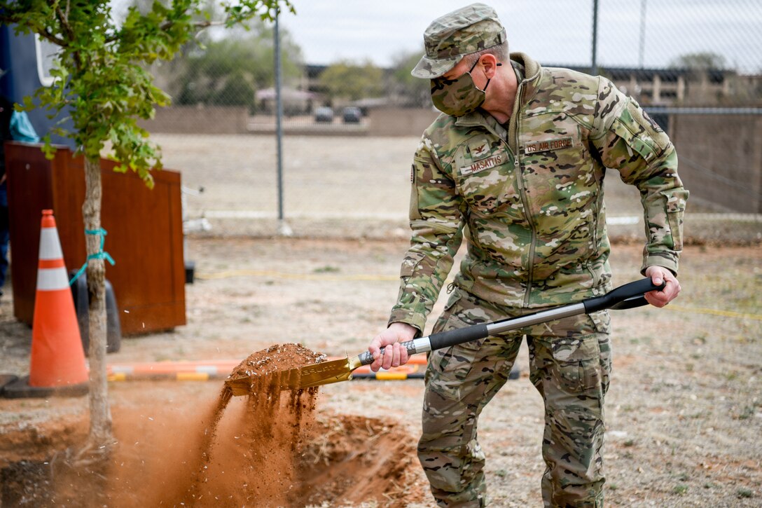The 27th Special Operations Wing commander, Col. Robert A. Masaitis, signs into effect Arbor Day ceremony at Cannon Air Force Base, N.M., on April 26, 2021. The tree planting ceremony highlights the goal of building a sustainable future. (U.S. Air Force photo by Senior Airman Marcel Williams)