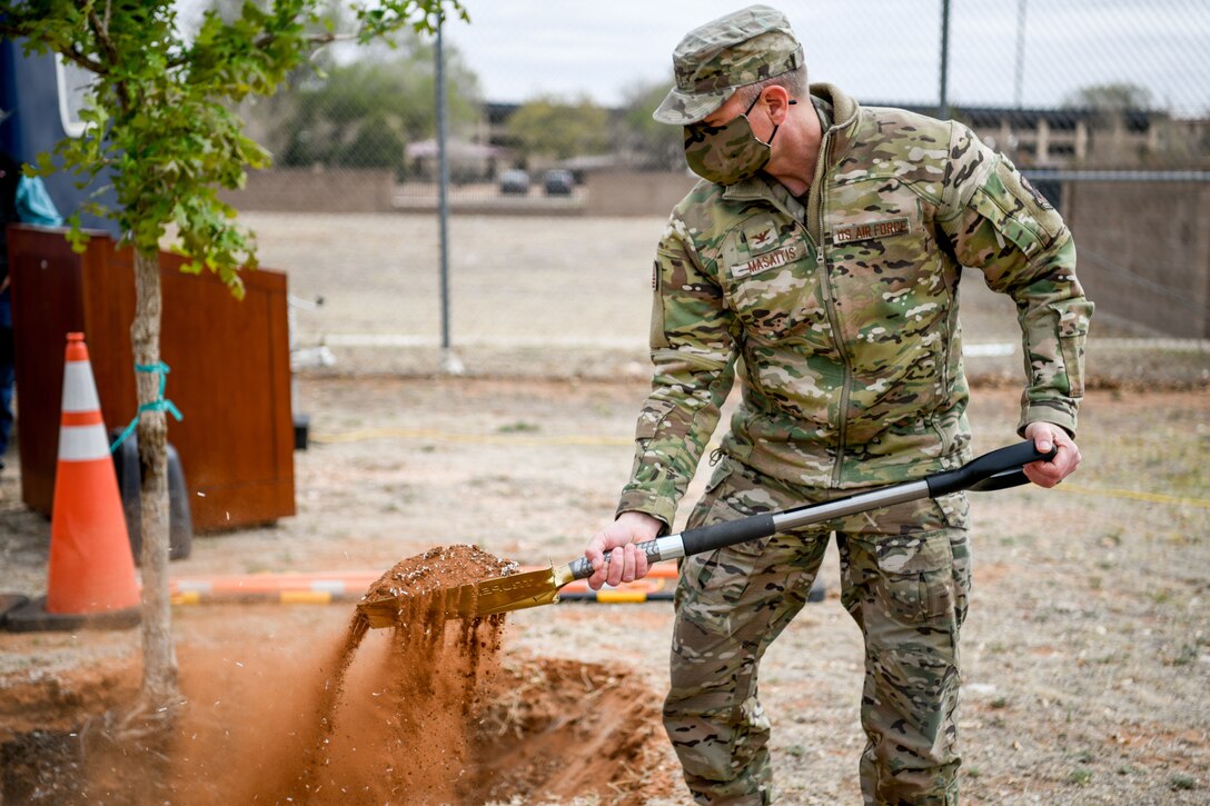 The 27th Special Operations Wing commander, Col. Robert A. Masaitis, signs into effect Arbor Day ceremony at Cannon Air Force Base, N.M., on April 26, 2021. The tree planting ceremony highlights the goal of building a sustainable future. (U.S. Air Force photo by Senior Airman Marcel Williams)