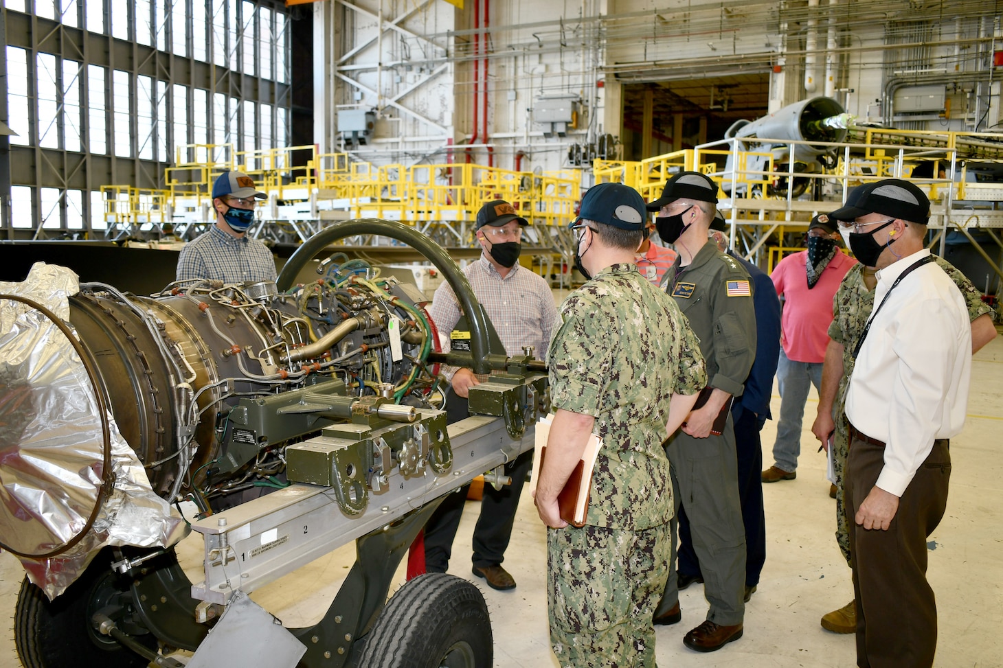 Leaders from Naval Air Systems Command; Commander, Fleet Readiness Centers; and Fleet Readiness Center East discuss V-22 Osprey maintenance and overhaul.