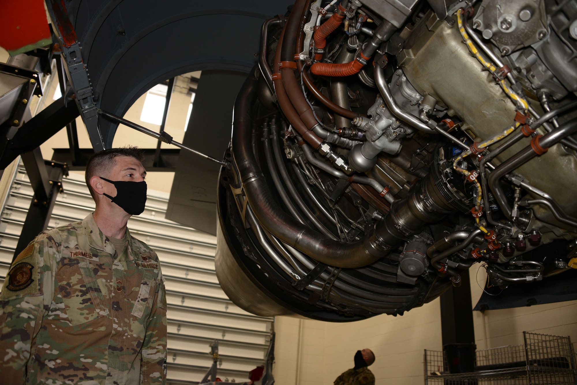 Senior Master Sgt. Robert Thames, the recruiting flight chief at Whiteman Air Force Base, Missouri, checks out the engine of a KC-46 Pegasus at the school house located at McConnell Air Force Base, Kansas, Apr. 9, 2021