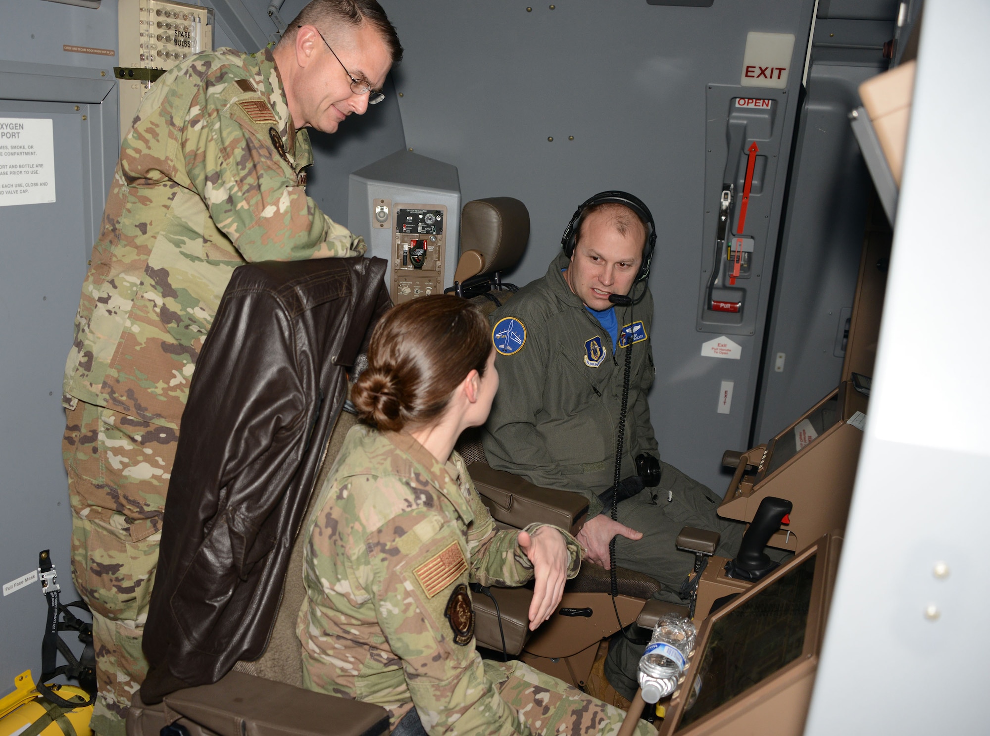 Lt. Col. Michael Rigoni, 352nd Recruiting Squadron commander and Master Sgt. Lyndsay Moen, the in-service recruiter at Little Rock Air Force Base, Arkansas, talk to a boom operator from the 931st Air Refueling Wing during a recruiting event at McConnell Air Force Base, Kansas, Apr. 10, 2021.