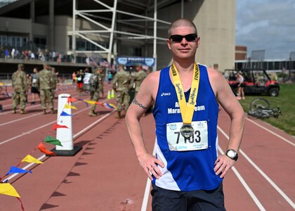 Capt. Raymond Youngs of Joint Force Headquarters, New Hampshire National Guard, poses at University of Nebraska's Ed Weir Stadium following his May 2, 2021,