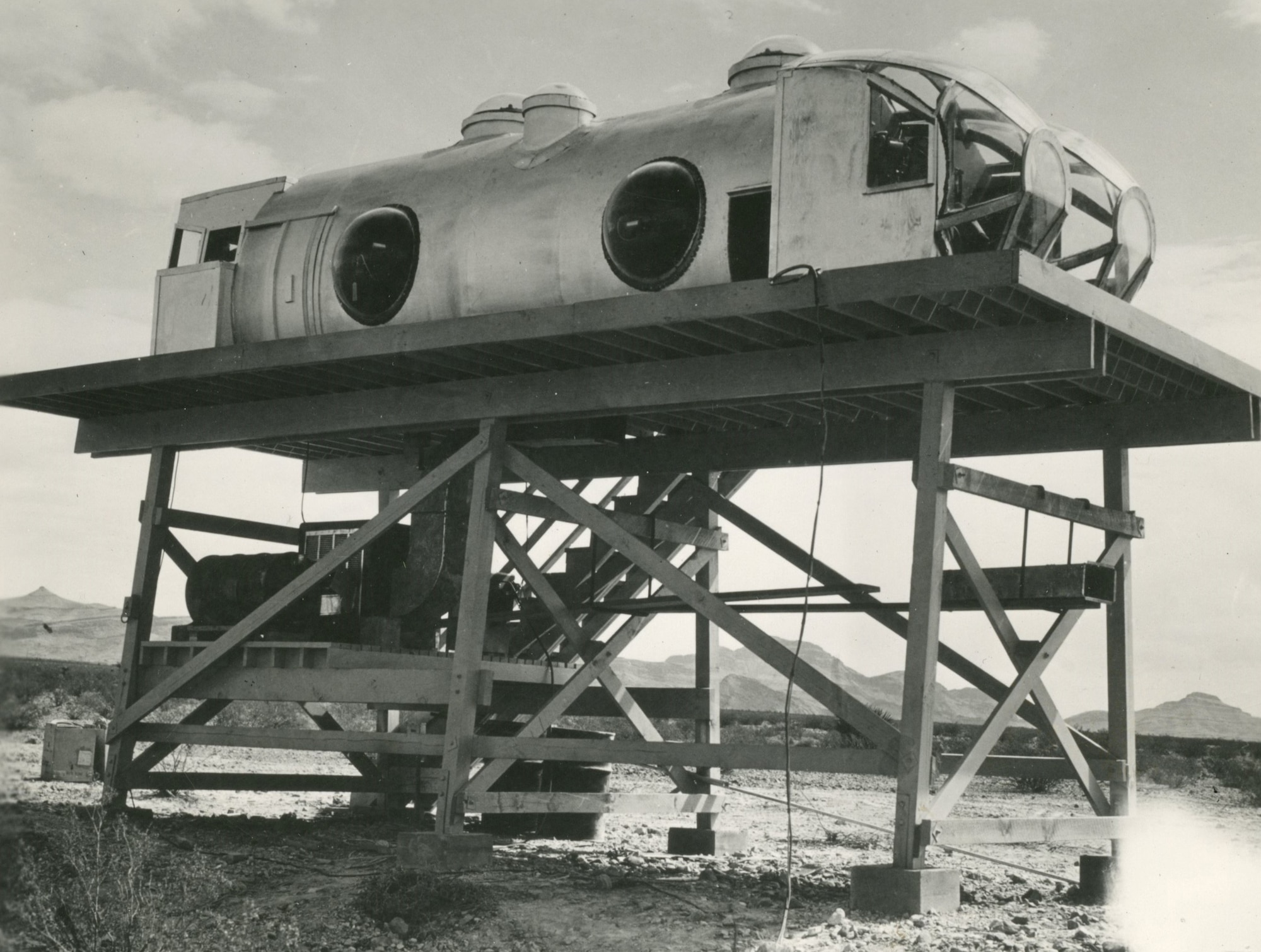 mock fuselage resting on top of a wooden structure