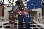 U.S. Army general, French Air Force general and U.S. Air Force general pose for a photo at U.S. Space Command headquarters.