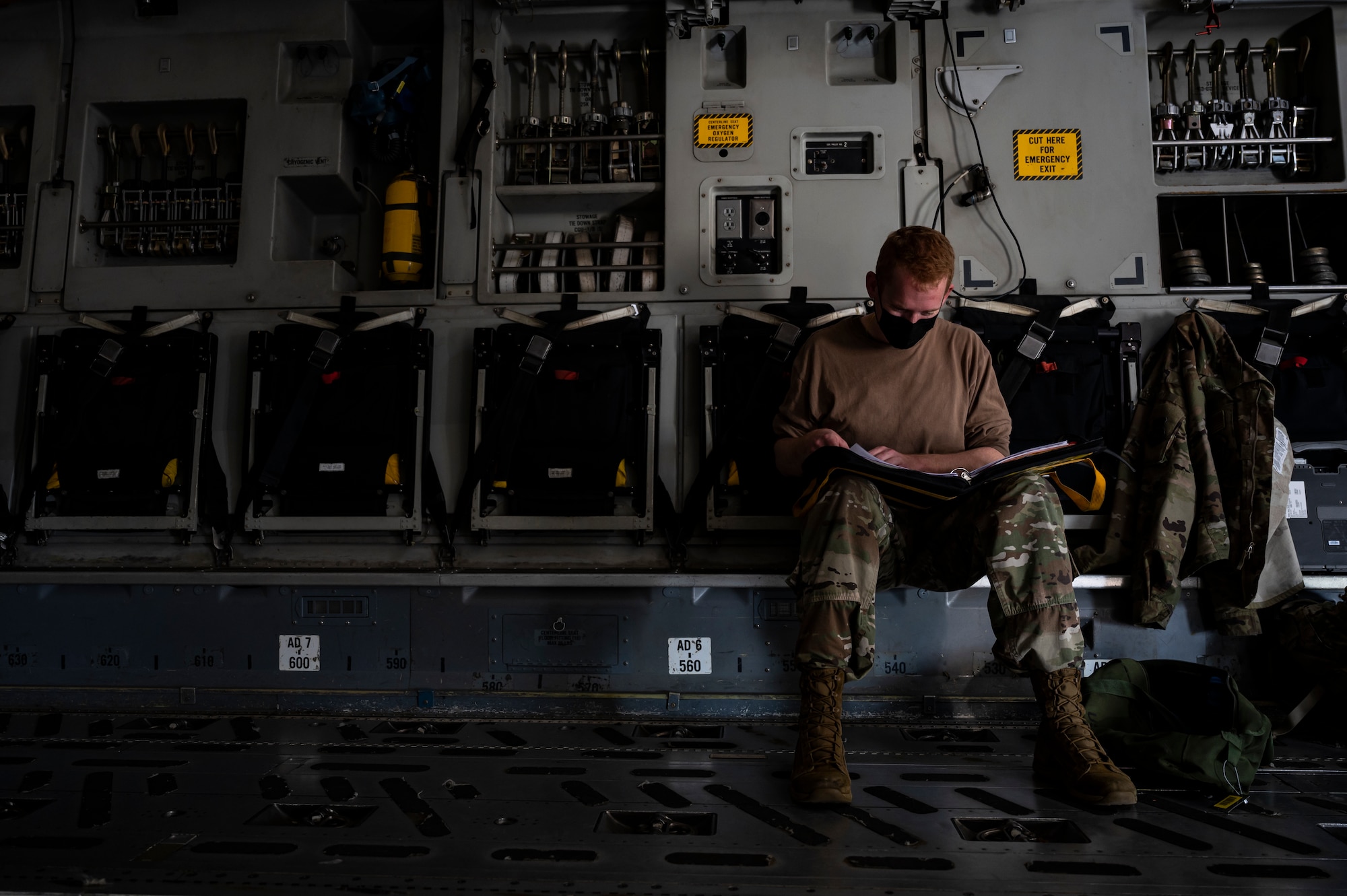 Tech. Sgt. John Thompson, 911th Aircraft Maintenance Squadron crew chief, reviews a checklist while inspecting a C-17 Globemaster III at the Pittsburgh International Airport Air Reserve Station, Pennsylvania, April 27, 2021.