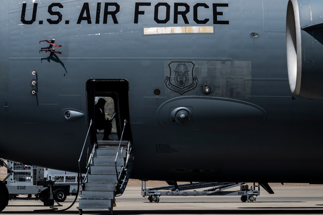 Staff Sgt. Nelson Bersal, 911th Aircraft Maintenance Squadron guidance and control technician, reviews a technical order while conducting a routine maintenance inspection on a C-17 Globemaster III at the Pittsburgh International Airport Air Reserve Station, Pennsylvania, April 27, 2021.