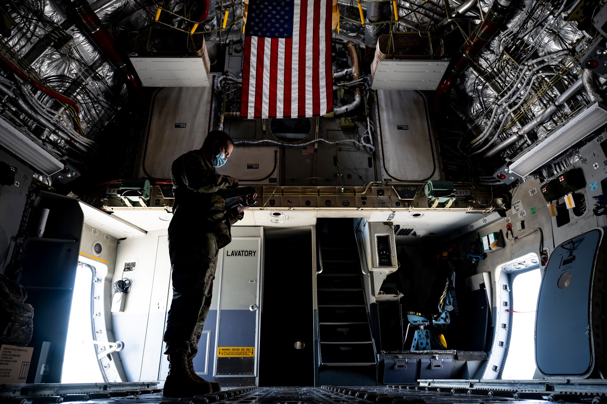 Master Sgt. Jai Kilmer, 911th Aircraft Maintenance Squadron quality assurance technician, reviews a checklist while inspecting maintenance procedures on a C-17 Globemaster III at the Pittsburgh International Airport Air Reserve Station, Pennsylvania, April 27, 2021.