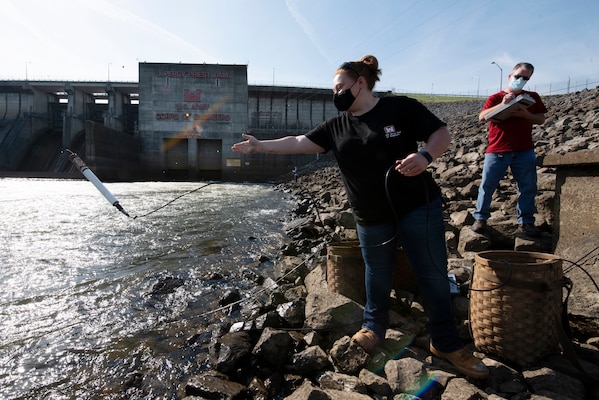 Sarah Pedrick, biologist in the U.S. Army Corps of Engineers Nashville District’s Water Management Section, and Mark Campbell, hydrologist, put a water quality instrument into the tailwater of the Stones River below J. Percy Priest Dam in Nashville, Tennessee April 27, 2021 while verifying the accuracy following recent calibrations. (USACE Photo by Lee Roberts)