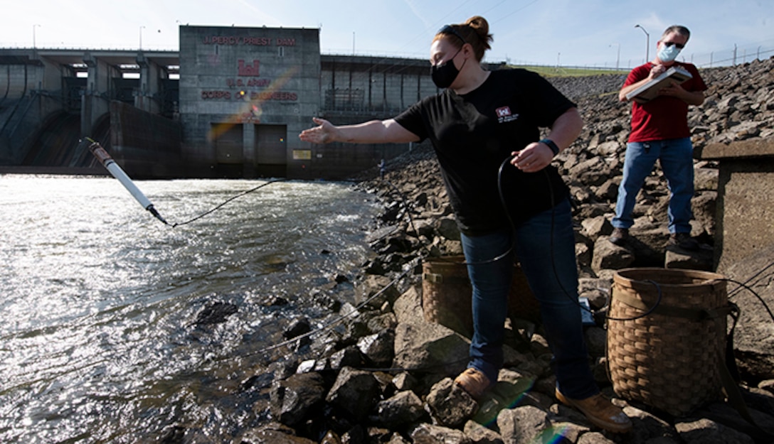 Sarah Pedrick, biologist in the U.S. Army Corps of Engineers Nashville District’s Water Management Section, and Mark Campbell, hydrologist, put a water quality instrument into the tailwater of the Stones River below J. Percy Priest Dam in Nashville, Tennessee April 27, 2021 while verifying the accuracy following recent calibrations. (USACE Photo by Lee Roberts)