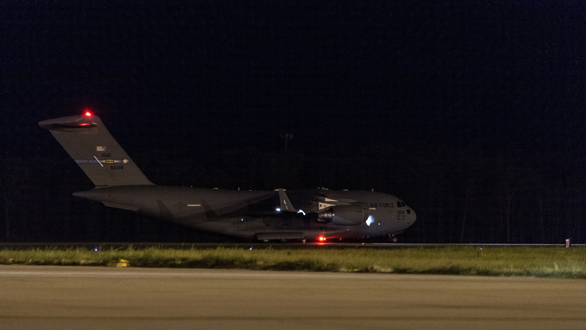 A C-17 Globemaster III accelerates down the runway at Dover Air Force Base, Delaware, April 23, 2021. The C-17 can perform tactical airlift missions, as well as aeromedical evacuations to and from locations anywhere in the world. (U.S. Air Force photo by Roland Balik)