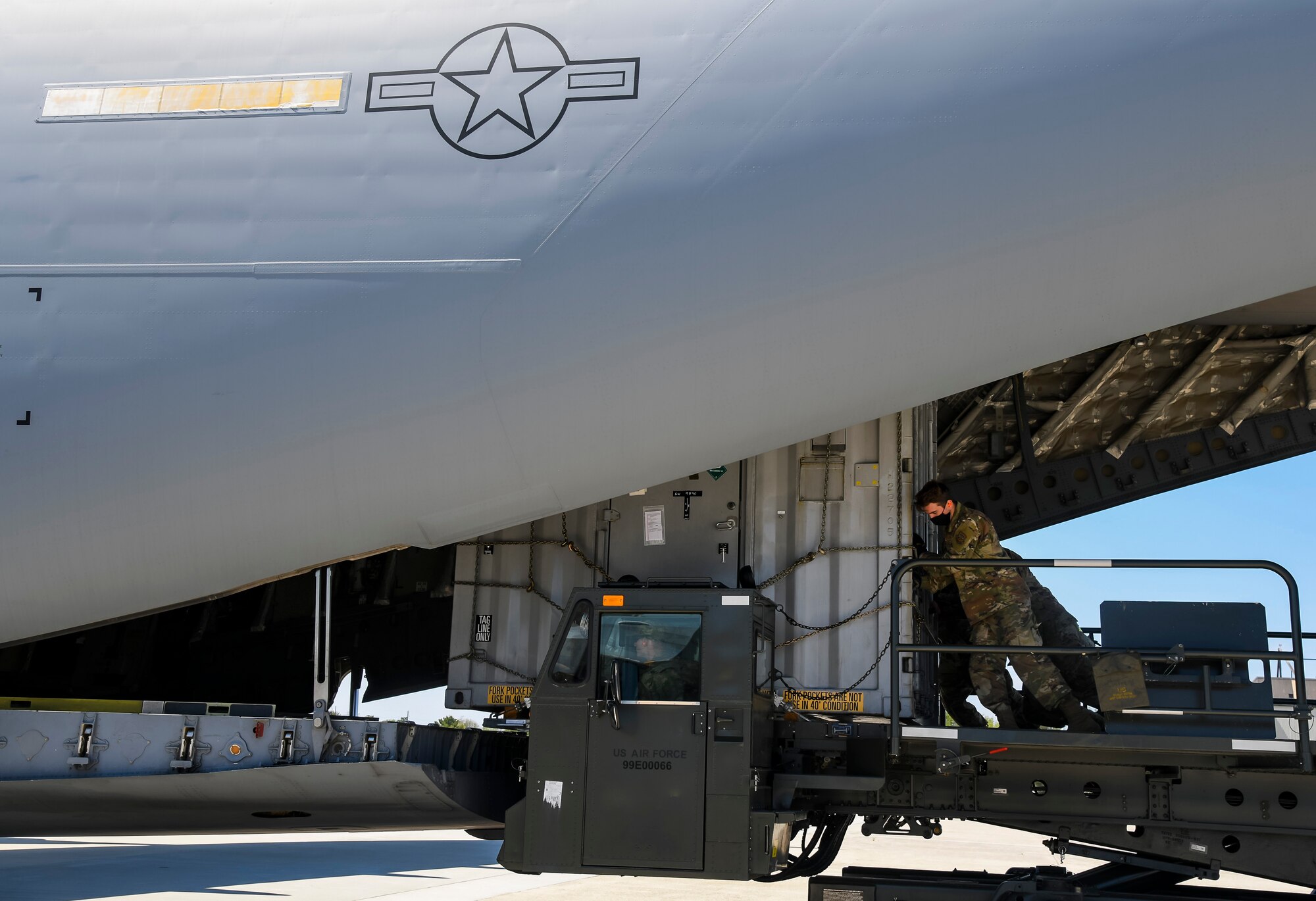Airmen from the 436th Aerial Port Squadron load cargo onto a C-17 Globemaster III at Dover Air Force Base, Delaware, April 23, 2021. The 436th APS, known as the “Superport” provides cargo and passenger movement services worldwide. (U.S. Air Force photo by Airman 1st Class Stephani Barge)