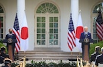 Japan's Prime Minister Yoshihide Suga and U.S. President Joe Biden hold a joint news conference in the Rose Garden at the White House in Washington, April 16, 2021.