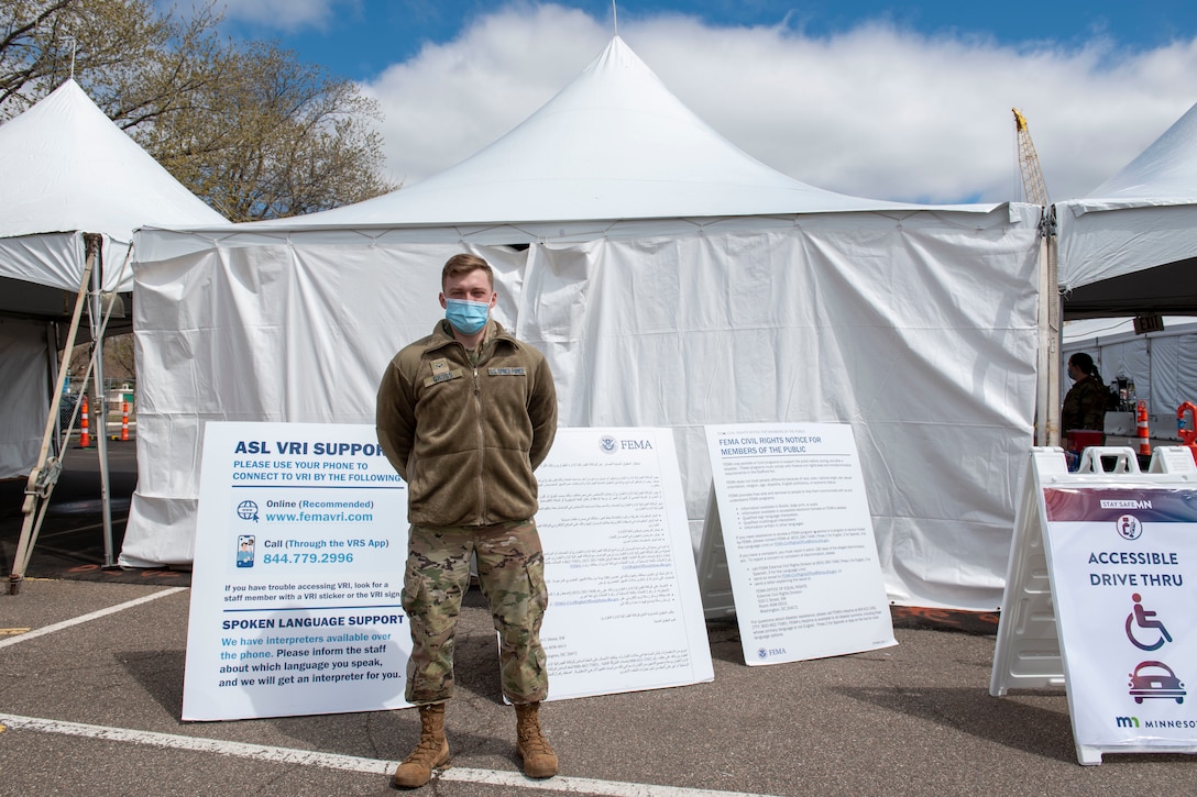 A Guardian poses for a photo at a community vaccination center.