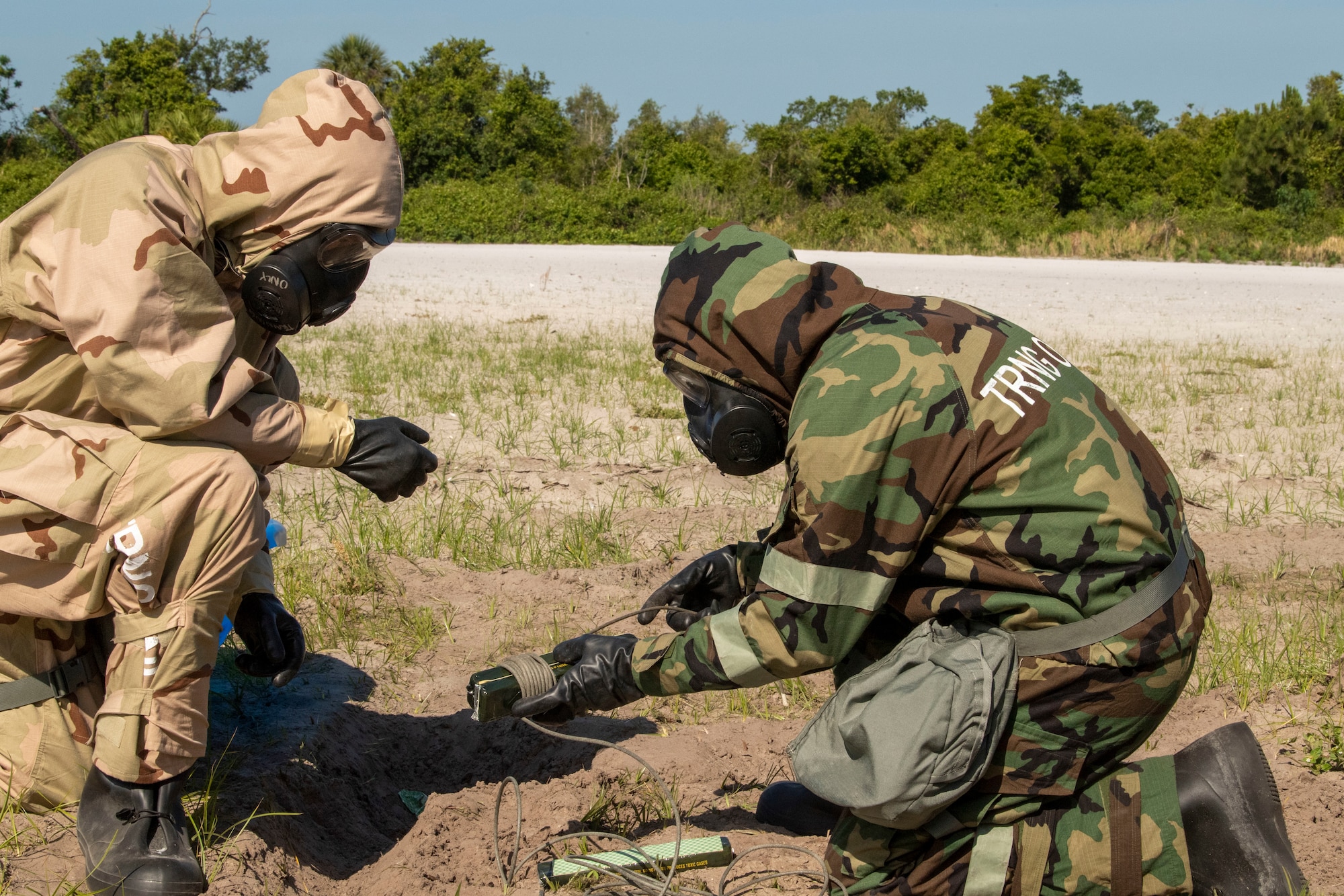 Airmen from the 6th Civil Engineer Squadron Explosive Ordnance Disposal (EOD) Flight set up C-4 charges at MacDill Air Force Base, Fla., April 29, 2021.