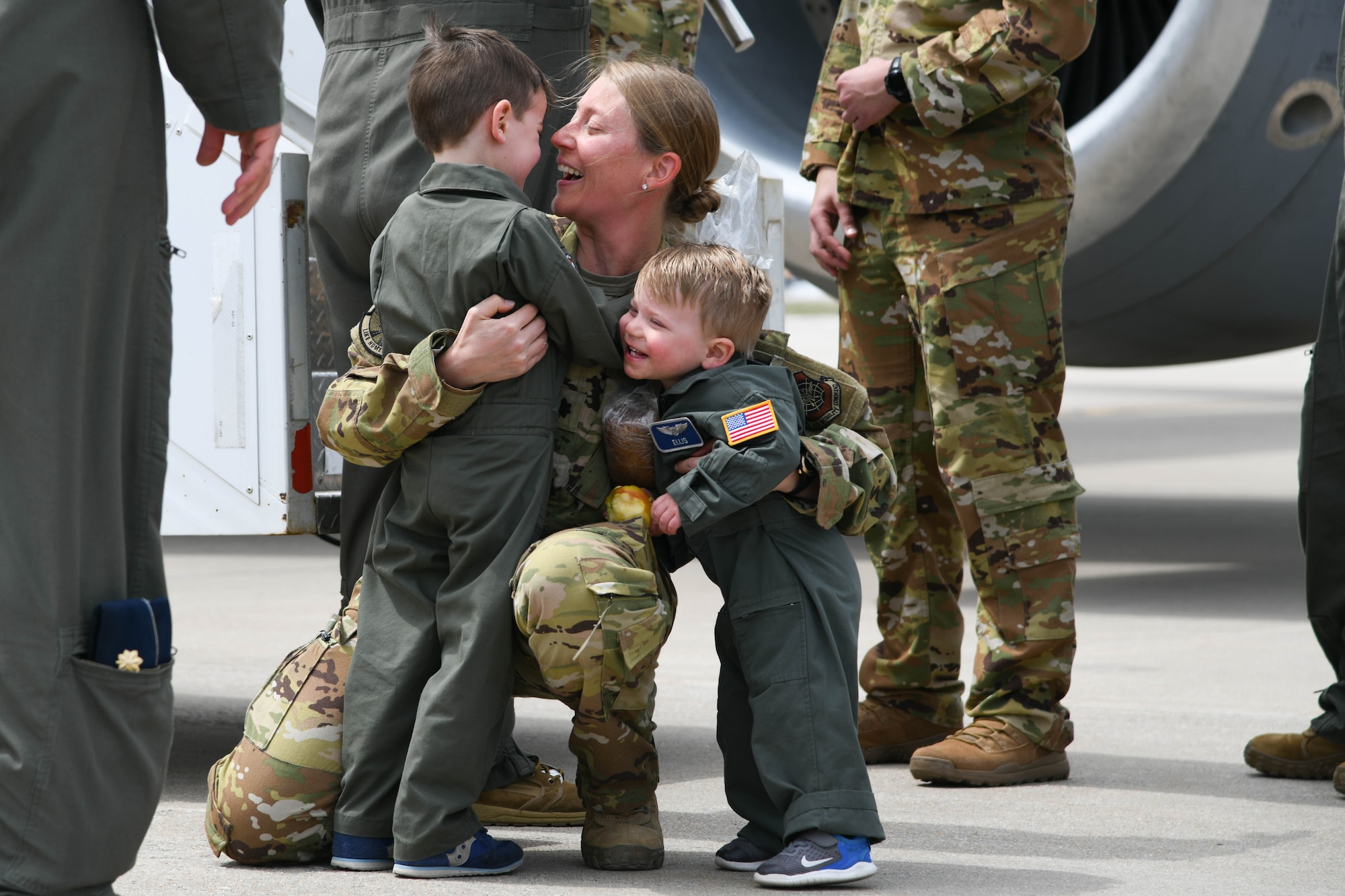 Lt. Col. Sara Bergkamp, 349th Air Refueling Squadron director of operations, embraces her children after returning home from deployment April 13, 2021, at McConnell Air Force Base, Kansas. While deployed, the team flew over 800 missions with the KC-135 Stratotanker to support joint and coalition aircraft throughout the CENTCOM area of
responsibility. (U.S. Air Force photo by Senior Airman Nilsa Garcia)