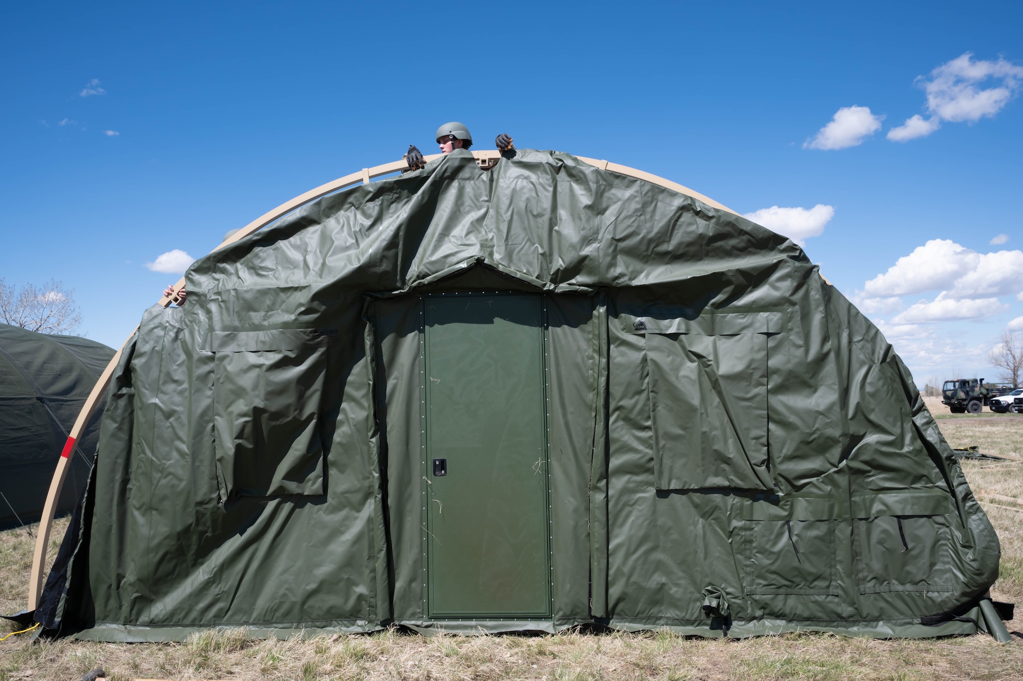 Airman 1st Class Janelle Caswell, 819th RED HORSE Squadron structural apprentice, assembles a sleeping tent May 3, 2021, at Malmstrom Air Force Base, Mont.