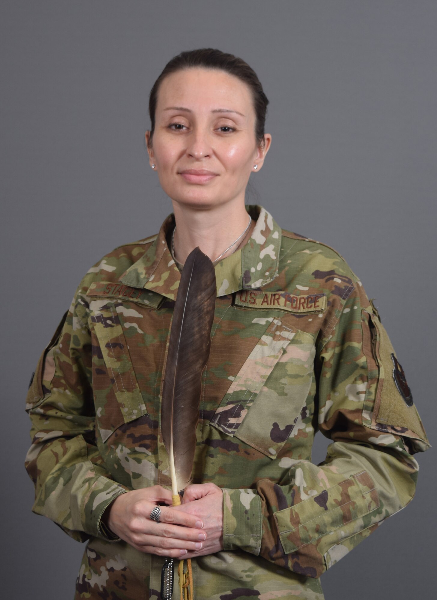 U.S. Air Force Master Sgt. Kristal Stacey, 81st Diagnostics and Therapeutics Squadron specialty imaging section chief, poses for a photo at Keesler Air Force Base, Mississippi, April 28, 2021. Stacey received her eagle feather as a part of the Mohawk Nation's tradition upon return from her deployment. (U.S. Air Force photo by Senior Airman Kimberly L. Mueller)