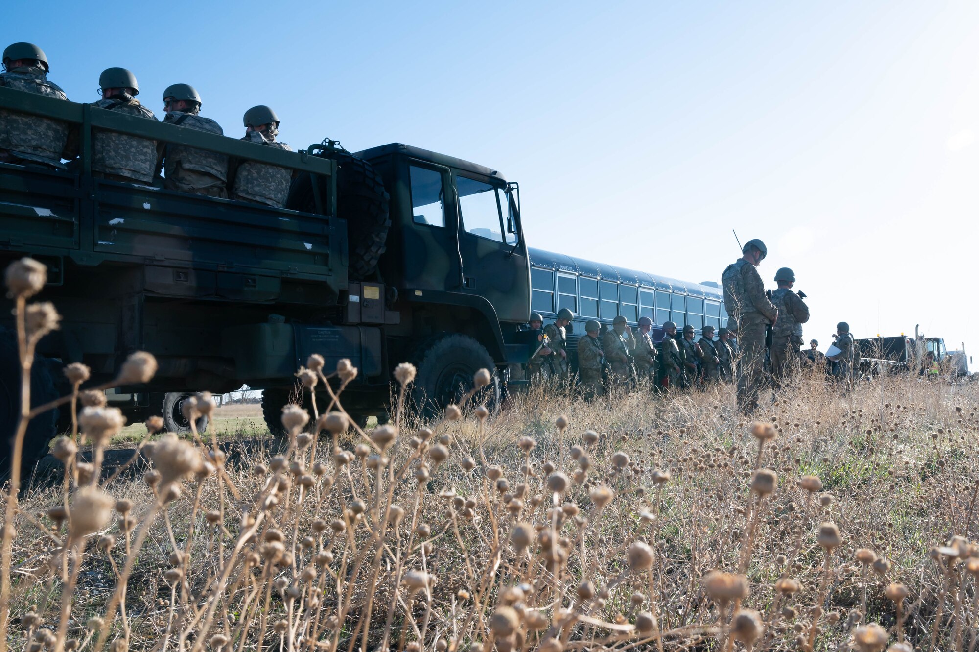 Members of the 819th RED HORSE Squadron arrive at a field near Pow Wow Pond at Malmstrom Air Force Base, Mont. for an exercise May 3, 2021.