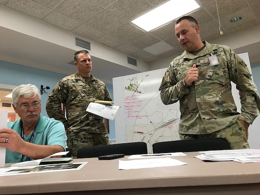 From right: Lt. Col. John Grabowski, deputy commander for cyber transformation at Fort Gordon, talks with Col. Daniel Hibner, commander, U.S. Army Corps of Engineers Savannah District, and Ken Gray, chief of Construction Division at USACE Savannah District, at Military Ocean Terminal Sunny Point, N.C., or MOTSU, following Hurricane Florence’s landfall in North Carolina Sept. 20, 2018. Photo by Russ Wicke, USACE Savannah District.