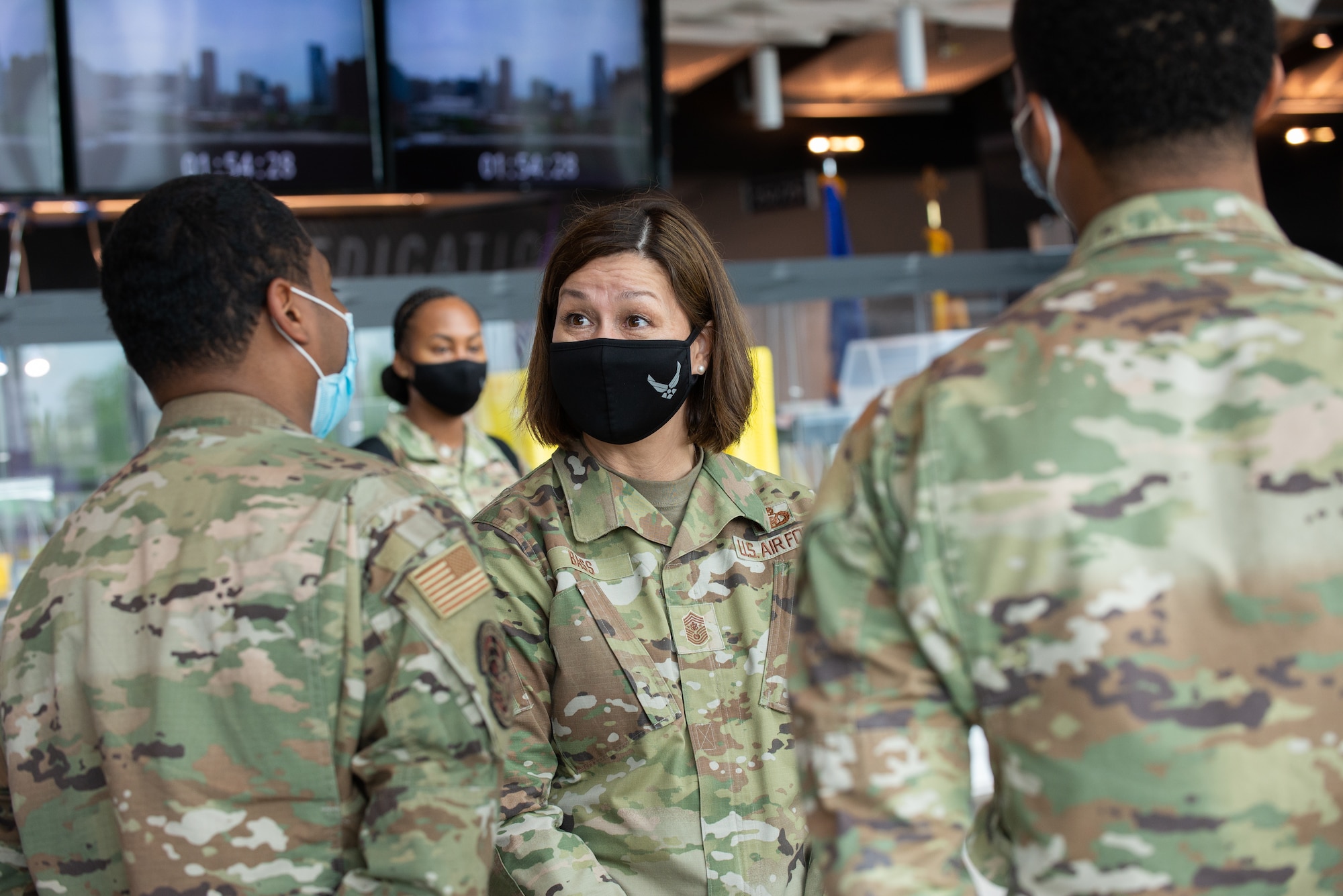 Chief Master Sgt. of the Air Force JoAnne S. Bass speaks to Airmen assigned to the 175th Wing, Maryland National Guard, while visiting the mass vaccination site at M&T Bank Stadium, Baltimore, on May 3, 2021.