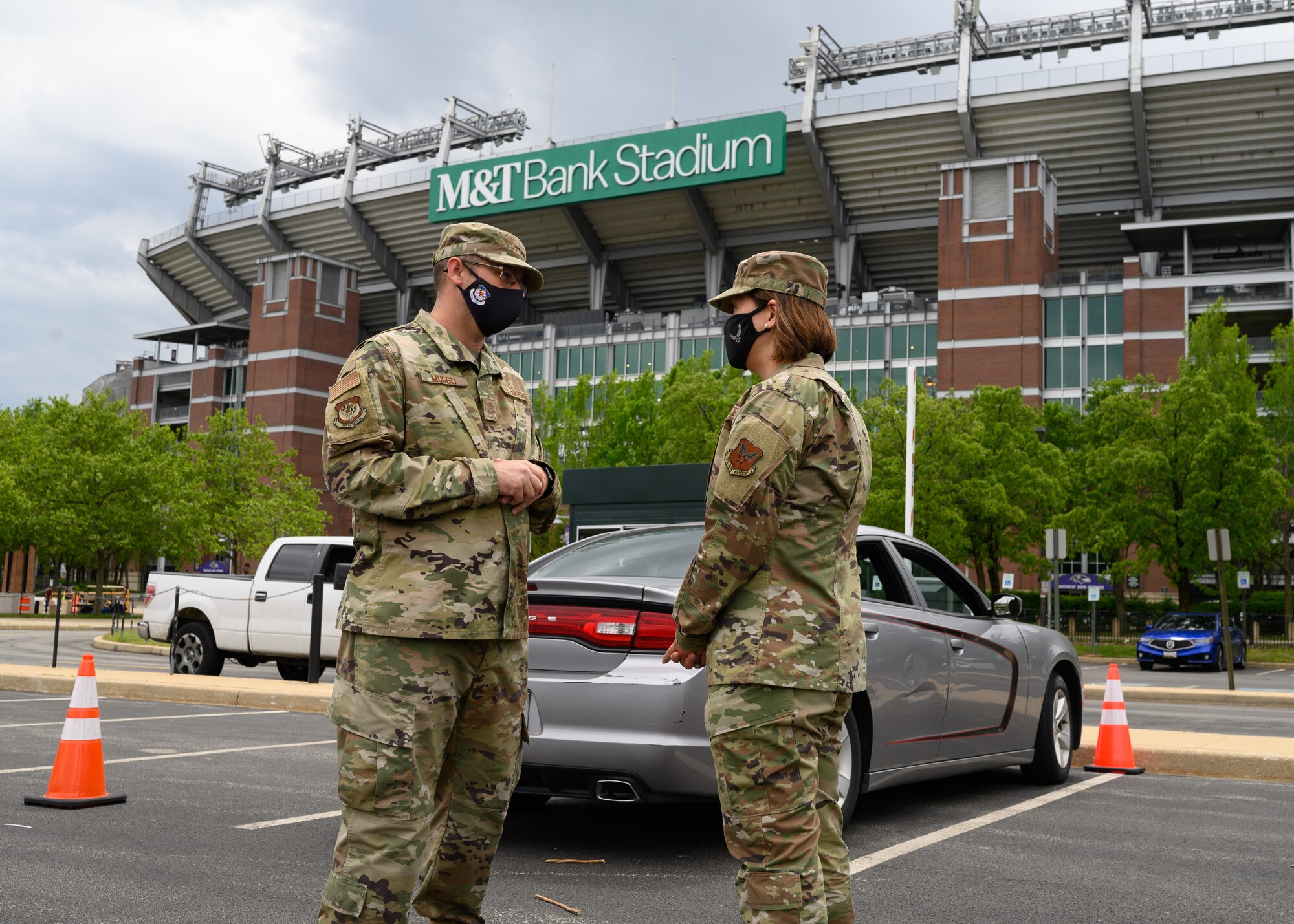 (From left) Chief Master Sgt. Paul Muggli, command chief for the 175th Wing, speaks with Chief Master Sgt. of the Air Force JoAnne S. Bass outside of the COVID-19 mass vaccination at M&T Bank Stadium, Baltimore, on May 3, 2021.