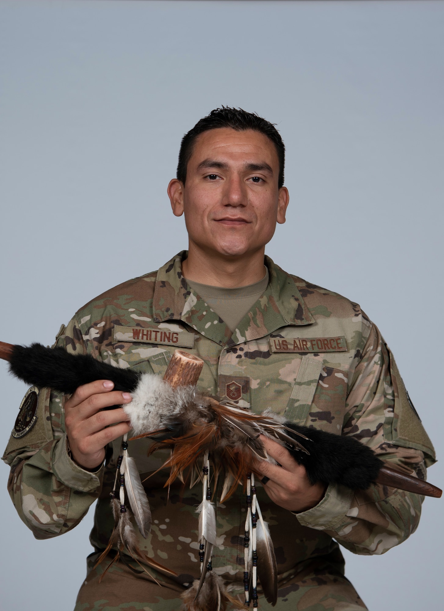U.S. Air Force Master Sgt. David Whiting, 81st Medical Group diagnostic imaging section chief, poses for a photo at Keesler Air Force Base, Mississippi, April 29, 2021. The Sacred Pipe of the Lakota Sioux in Whiting's grip is a symbolism for unity and transition of life. (U.S. Air Force photo by Senior Airman Kimberly L. Mueller)