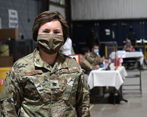 U.S. Air Force Lt. Col. Christine Estacion, health services administrator assigned to the 175th Medical Group, poses for a photograph at the COVID-19 mass vaccination site at the Maryland State Fairgrounds in Timonium, Md., April 15, 2021.