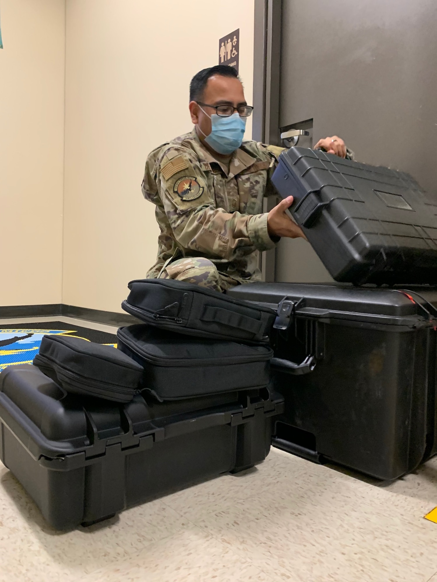Master Sgt. Juan De La Rosa, 318th Training Squadron, “A” Flight Chief, sets up the paint simulator at Joint Base San Antonio, Lackland, Texas, April 28, 2021. The newly acquired software allows mobile training teams to travel with the equipment and provide instruction to partner nation members with real-time results while eliminating expenses. (U.S. Air Force photo by Vanessa R. Adame)