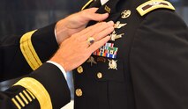 Col. Andrew R. “Drew” Morgan receives the Army astronaut device from Lt. Gen. Daniel L. Karbler, commanding general of U.S. Army Space and Missile Defense Command, during a May 5 ceremony at the National Museum of the United States Army at Fort Belvoir, Virginia. (Photo by Ronald Bailey)