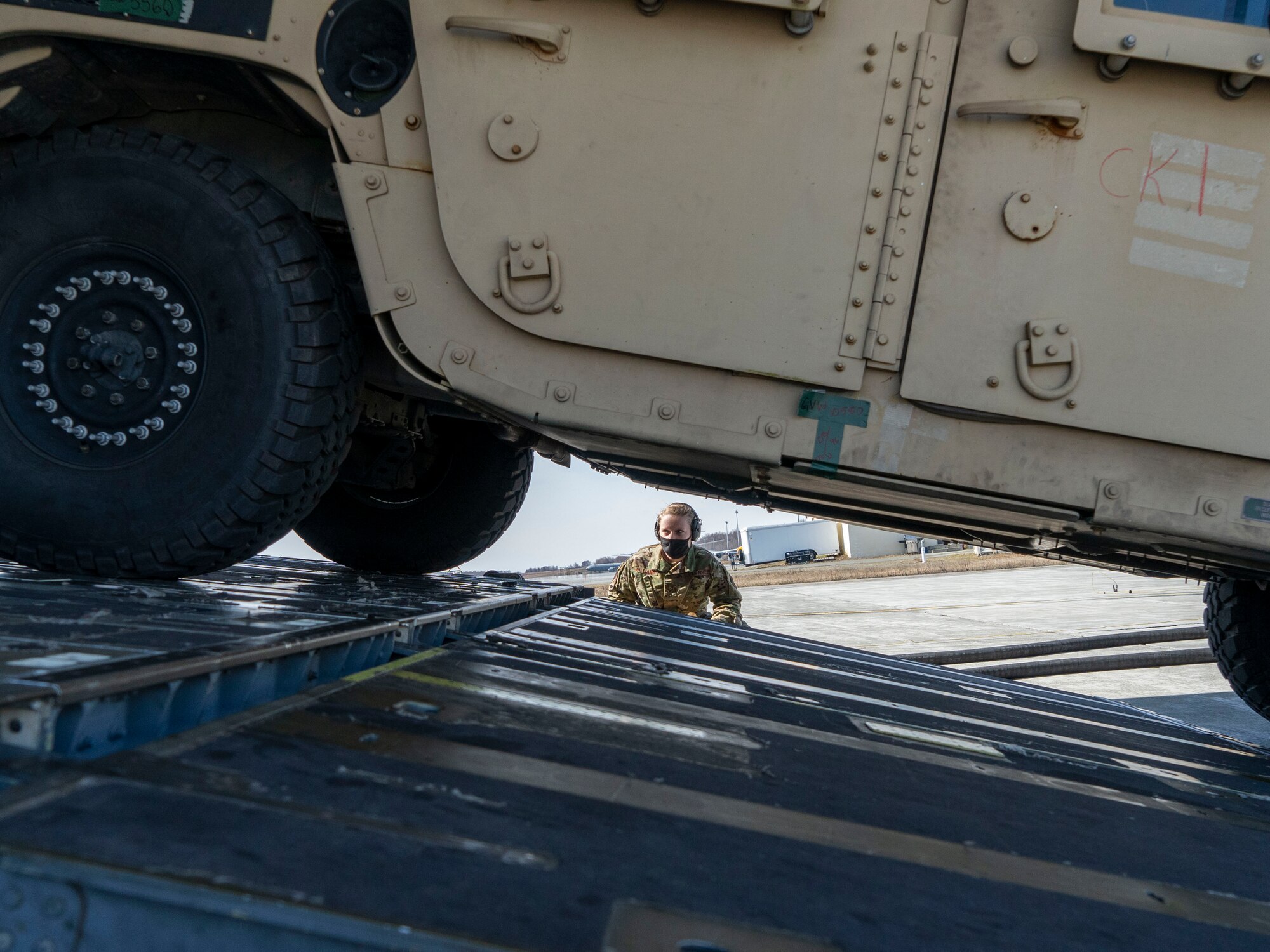 U.S. Air Force Senior Airman Jayme Williams, a 732d Air Mobility Squadron Air Terminal Operations Center information controller, observes cargo being unloaded from a C-17 Globemaster III assigned to Joint Base Lewis-McChord, Washington, on the flightline at Joint Base Elmendorf-Richardson, Alaska, May 1, 2021, in support of Northern Edge 2021. Approximately 15,000 U.S. service members are participating in a joint training exercise hosted by U.S. Pacific Air Forces May 3-14, 2021, on and above the Joint Pacific Alaska Range Complex, the Gulf of Alaska, and temporary maritime activities area. NE21 is one in a series of U.S. Indo-Pacific Command exercises designed to sharpen the joint forces’ skills; to practice tactics, techniques, and procedures; to improve command, control and communication relationships; and to develop cooperative plans and programs.