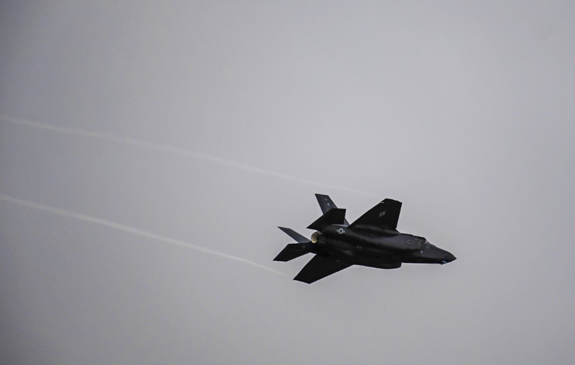 An F-35 Lightning II from Hill Air Force Base, Utah, flies over the flight line at Mountain Home AFB, Idaho, April 28, 2021. The F-35 participated in exercise Rainier War, testing its abilities to employ air combat capabilities during a time of potentially imminent foreign aggression.