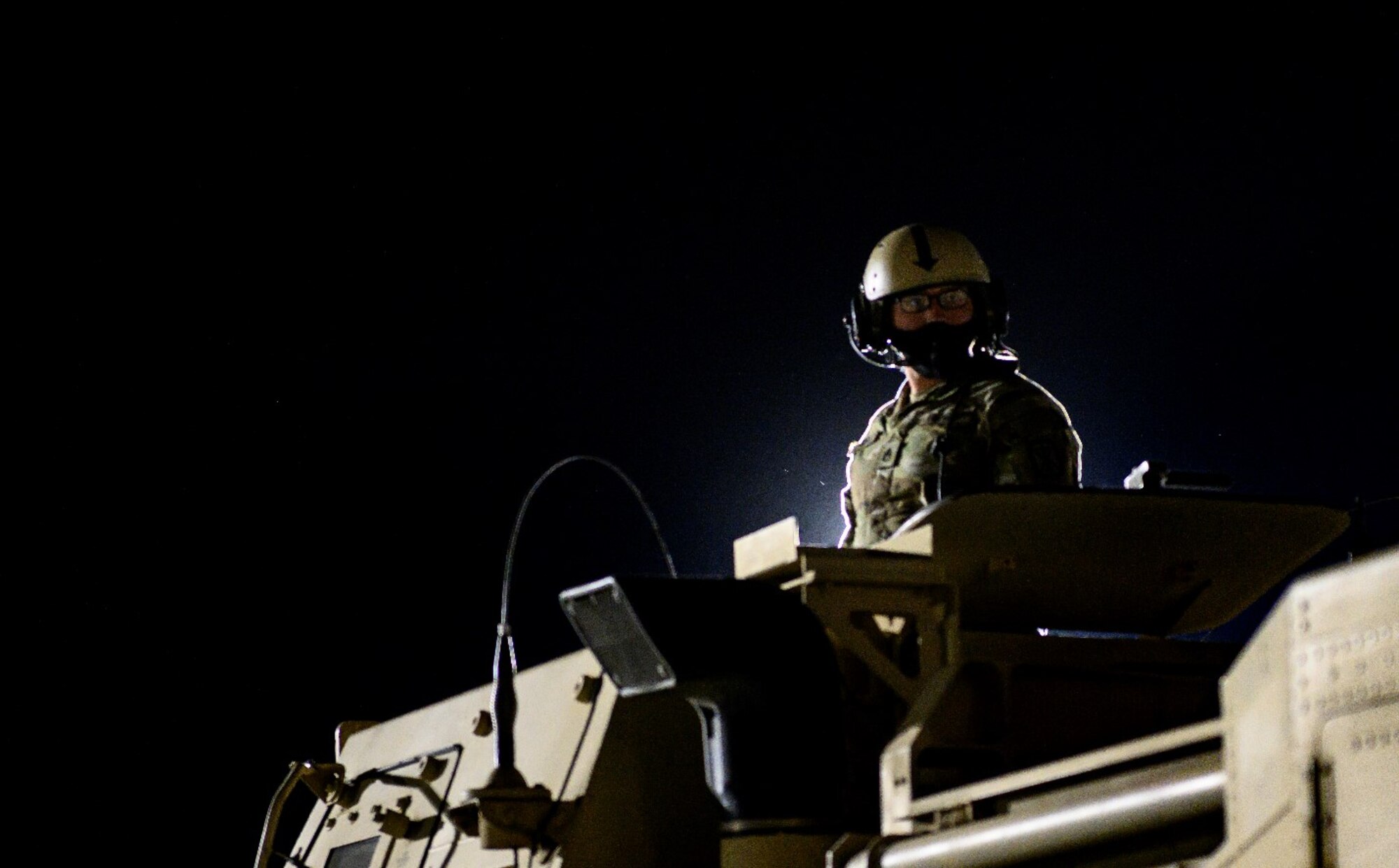 A U.S. Army Soldier waits for direction atop a High Mobility Artillery Rocket System April 27, 2021, at Mountain Home Air Force Base, Idaho. The HIMARS was used both as a simulated offensive capability as part of exercise Rainier War and as a means of training for various air mobility units who were able to familiarize the system’s configuration within cargo aircraft such as the C-17 Globemaster III.