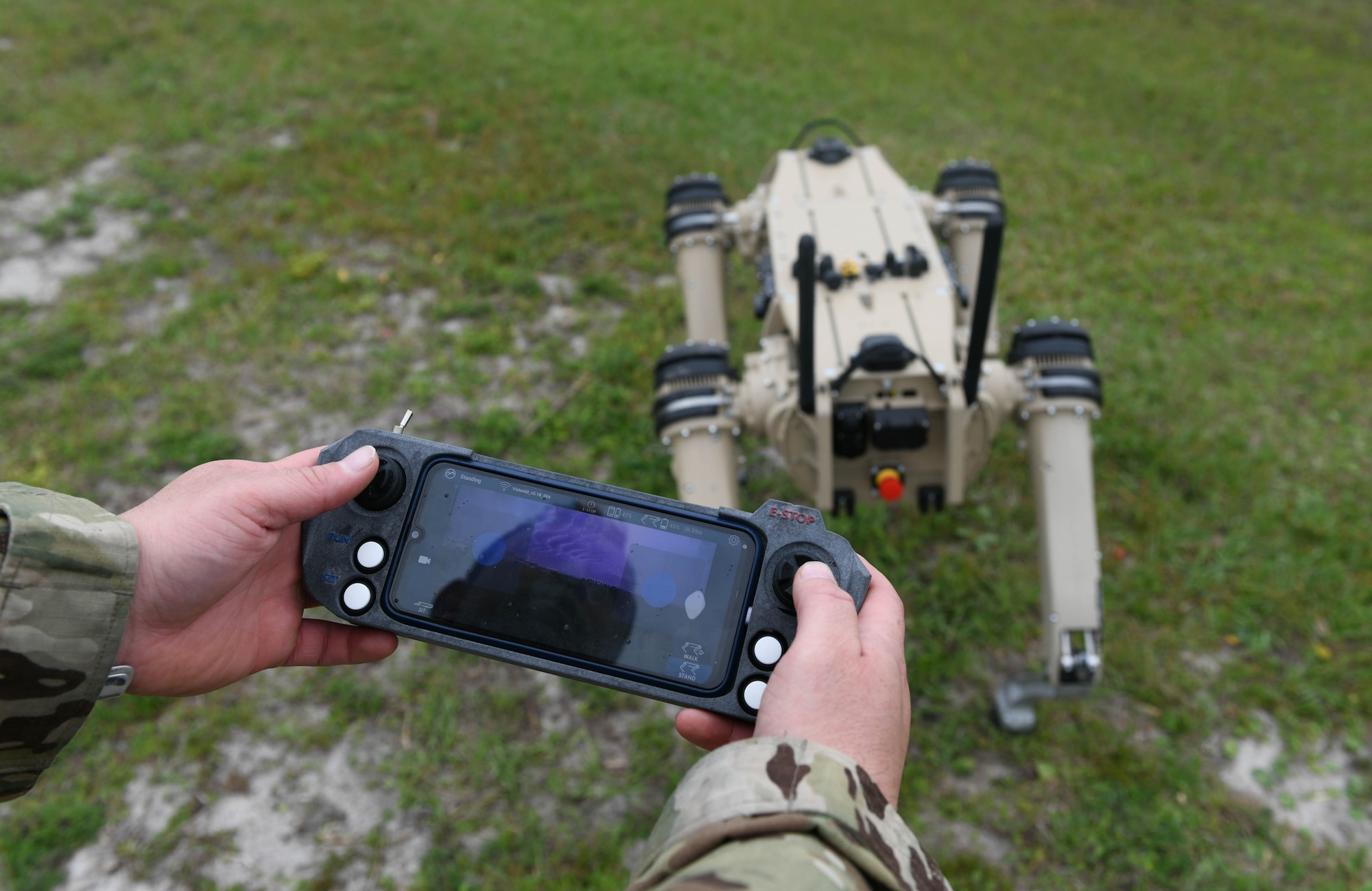 Master Sgt. Krystoffer Miller, 325th Security Forces Squadron operations support superintendent, operates a Quad-legged Unmanned Ground Vehicle at Tyndall Air Force Base, Fla., March 24, 2021. The purpose of the Q-UGV is to add an extra level of protection to base. (U.S. Air Force photo by Airman 1st Class Anabel Del Valle)