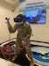 Staff Sgt. Julia Reyna, 318th Training Squadron Structures and Corrosion Instructor, uses the paint simulator during a demonstration at Joint Base San Antonio, Lackland, Texas, April 28, 2021. The newly acquired software allows mobile training teams to travel with the equipment and provide instruction to partner nation members with real-time results while eliminating expenses. (U.S. Air Force photo by Vanessa R. Adame)