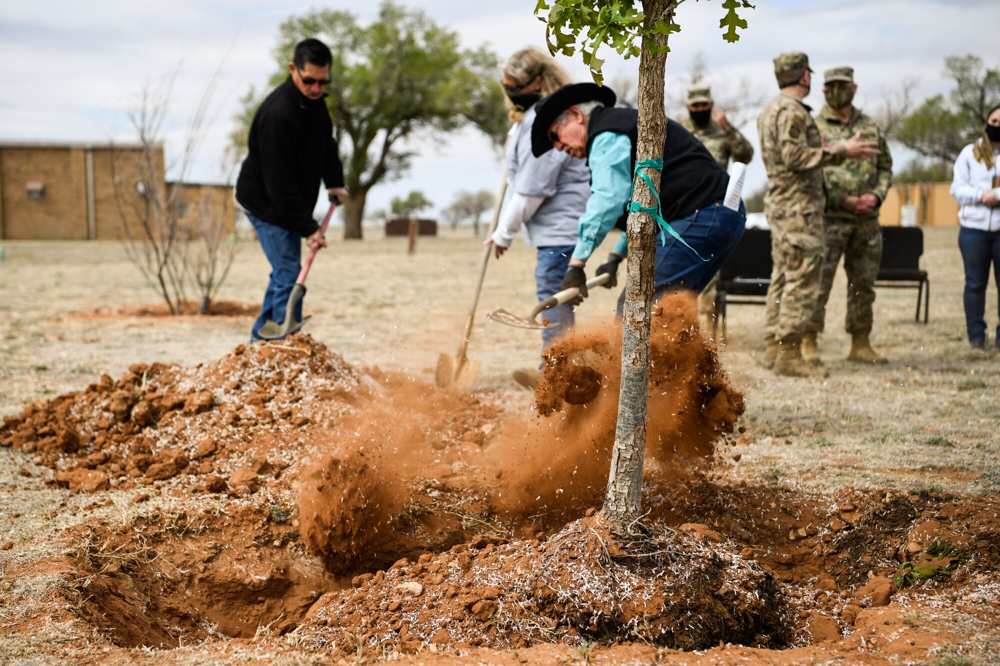 The 27th Special Operations Wing commander, Col. Robert A. Masaitis, signs into effect Arbor Day ceremony at Cannon Air Force Base, N.M., on April 26, 2021. The tree planting ceremony highlights the goal of building a sustainable future. (U.S. Air Force photo by Senior Airman Marcel Williams)