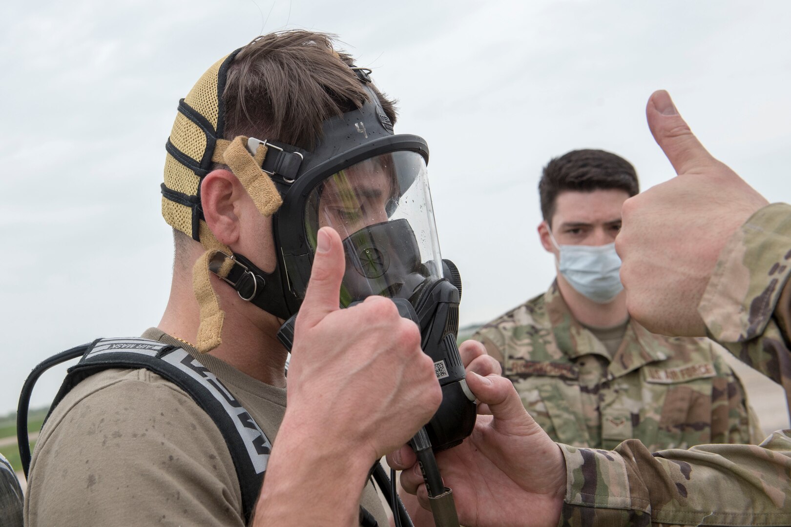 U.S. Air Force 1st Lt Samuel Gerard, 167th bioenvironmental engineering, gives a thumbs-up indicating his mask is secure and operational during a during a Counter CBRN (Chemical, Biological, Radiological, and Nuclear) All-Hazard Management Response, or CAMR, exercise at the 167th Airlift Wing, Shepherd Field,, Martinsburg, West Virginia, April 30, 2021. CAMR is a hybrid program of classroom lecture, discussion and tabletop exercises that culminate in a full scale emergency response exercise.