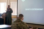 U.S. Air Force Lt. Col. Kevin Culbert, 167th Medical Group commander, defines the term extremism while briefing members of the 167th Medical Group and wing headquarters as part of an extremism stand down during May’s unit training assembly at the 167th Airlift Wing, Martinsburg, West Virginia, May 1, 2021. The wing held the stand down at the direction of the Secretary of Defense in an effort to combat extremism in the ranks.