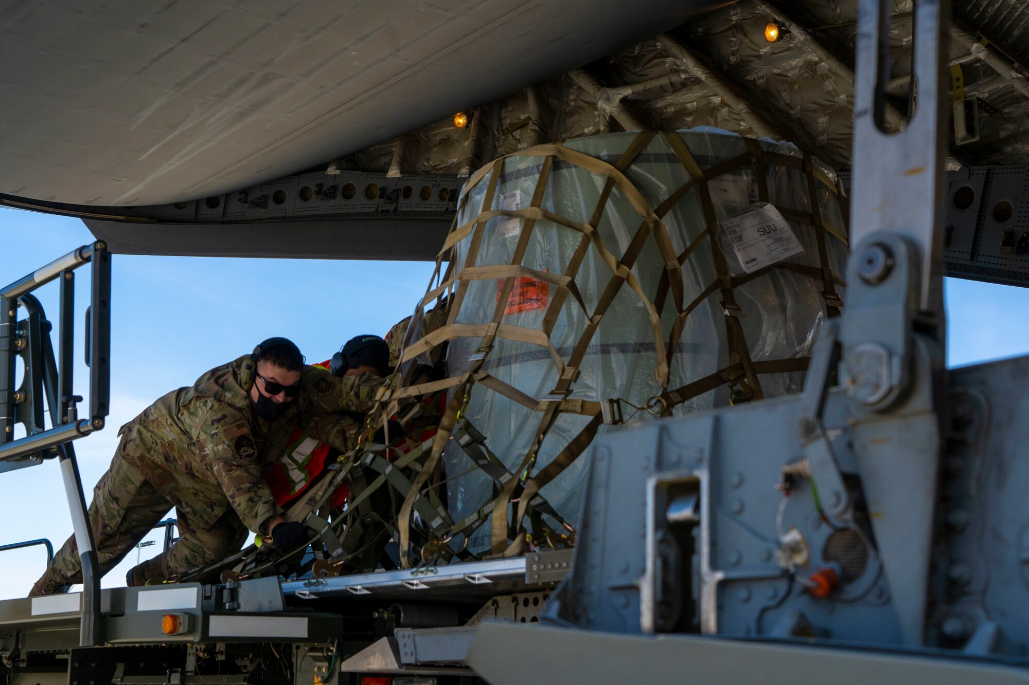 Airmen assigned to the 732d Air Mobility Squadron load cargo onto a C-17 Globemaster III assigned to Joint Base Lewis-McChord, Washington, on the flightline at Joint Base Elmendorf-Richardson, Alaska, May 1, 2021, in support of Northern Edge 2021. Approximately 15,000 U.S. service members are participating in a joint training exercise hosted by U.S. Pacific Air Forces May 3-14, 2021, on and above the Joint Pacific Alaska Range Complex, the Gulf of Alaska, and temporary maritime activities area. NE21 is one in a series of U.S. Indo-Pacific Command exercises designed to sharpen the joint forces’ skills; to practice tactics, techniques, and procedures; to improve command, control and communication relationships; and to develop cooperative plans and programs.