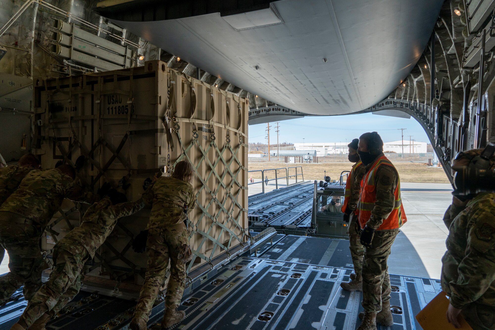 Airmen assigned to the 732d Air Mobility Squadron and 773d Logistic Readiness Squadron offload cargo from a C-17 Globemaster III, assigned to Joint Base Lewis-McChord, Washington, onto a K-Loader at Joint Base Elmendorf-Richardson, Alaska, May 1, 2021, in support of Northern Edge 2021. Approximately 15,000 U.S. service members are participating in a joint training exercise hosted by U.S. Pacific Air Forces May 3-14, 2021, on and above the Joint Pacific Alaska Range Complex, the Gulf of Alaska, and temporary maritime activities area. NE21 is one in a series of U.S. Indo-Pacific Command exercises designed to sharpen the joint forces’ skills; to practice tactics, techniques, and procedures; to improve command, control and communication relationships; and to develop cooperative plans and programs.