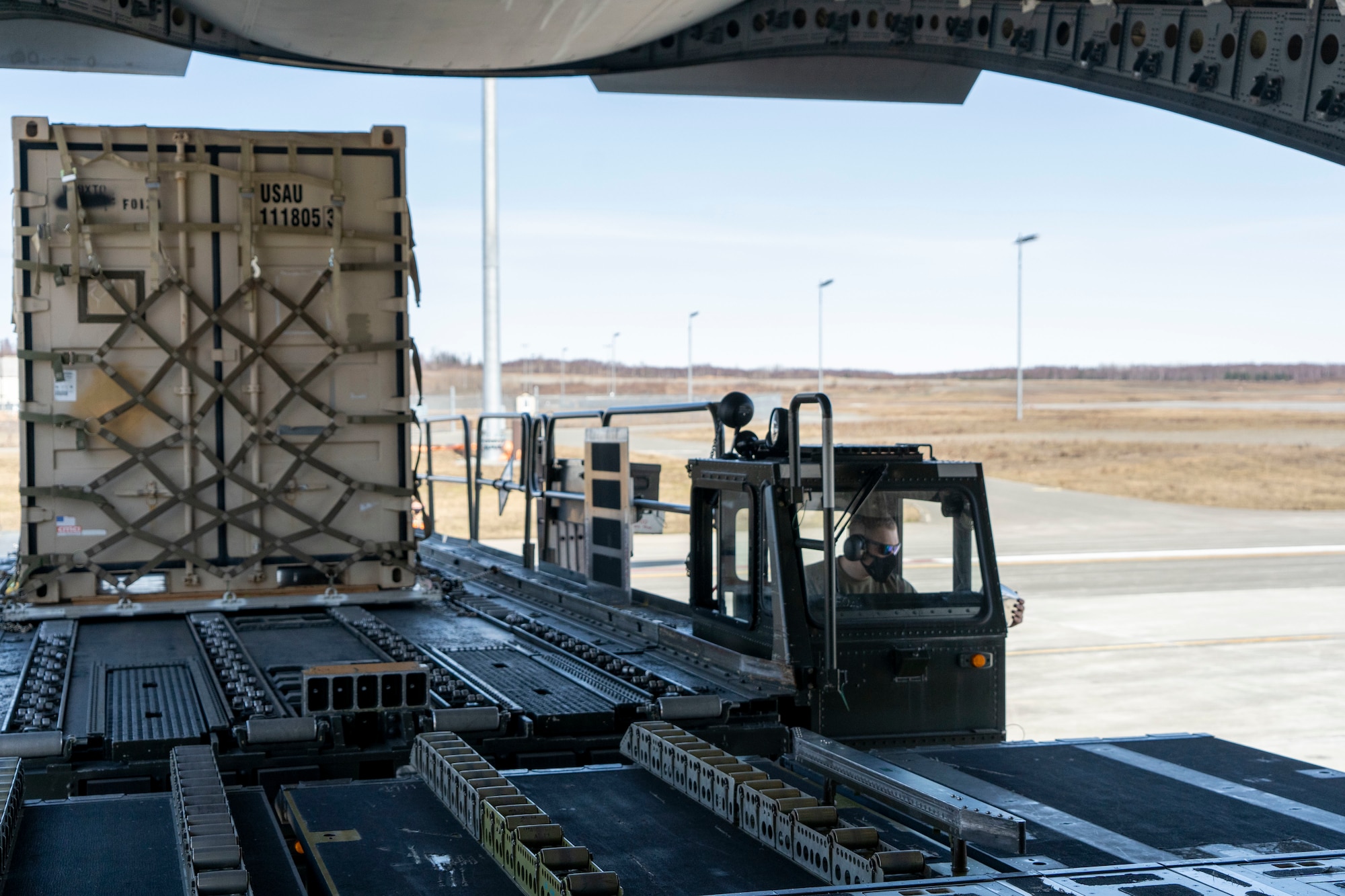 U.S. Air Force Airman 1st Class Dustin Jenkins, a 732d Air Mobility Squadron air freight technician, maneuvers a K-loader near a C-17 Globemaster III assigned to Joint Base Lewis-McChord, Washington, on the flightline at Joint Base Elmendorf-Richardson, Alaska, May 1, 2021, in support of Northern Edge 2021. Approximately 15,000 U.S. service members are participating in a joint training exercise hosted by U.S. Pacific Air Forces May 3-14, 2021, on and above the Joint Pacific Alaska Range Complex, the Gulf of Alaska, and temporary maritime activities area. NE21 is one in a series of U.S. Indo-Pacific Command exercises designed to sharpen the joint forces’ skills; to practice tactics, techniques, and procedures; to improve command, control and communication relationships; and to develop cooperative plans and programs.