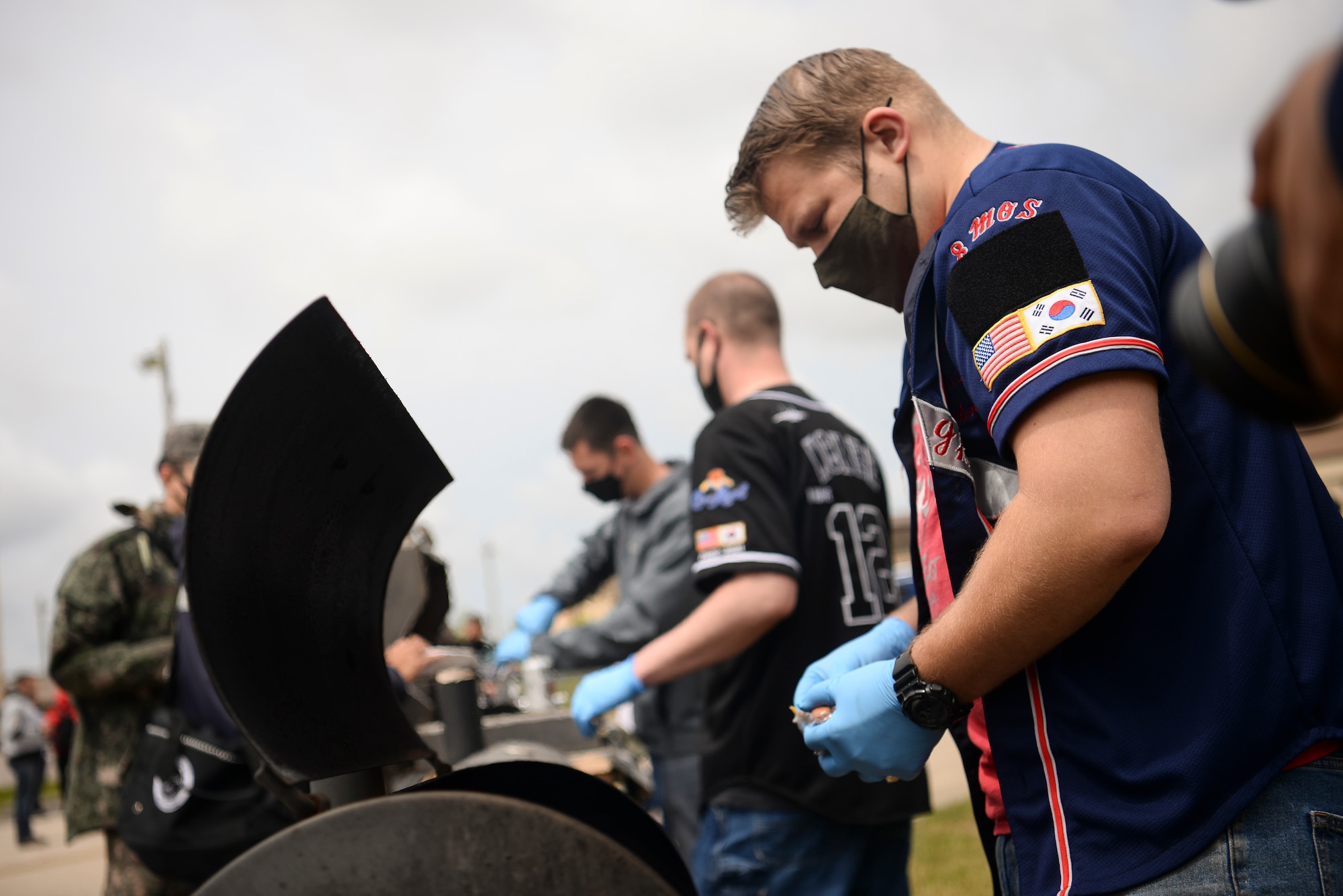 Airmen prepare food during a competition.
