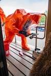 Air Force Staff Sgt. Gregory Kassner, a team member with the 44th Civil Support Team collects a sample of potentially hazardous material during a multi-CST exercise in Ft. Walton Beach, Tuesday May 4.